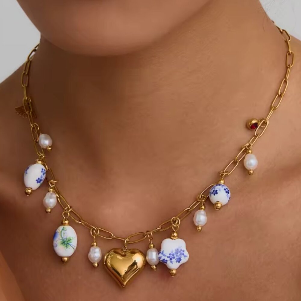 Gold-plated necklace with ceramic charms, made of titanium stainless steel.